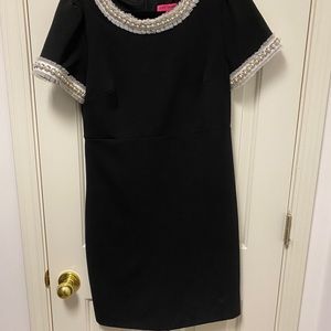 black dress with detailed sleeves